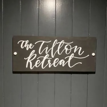The Tilton Retreat hand-lettered sign